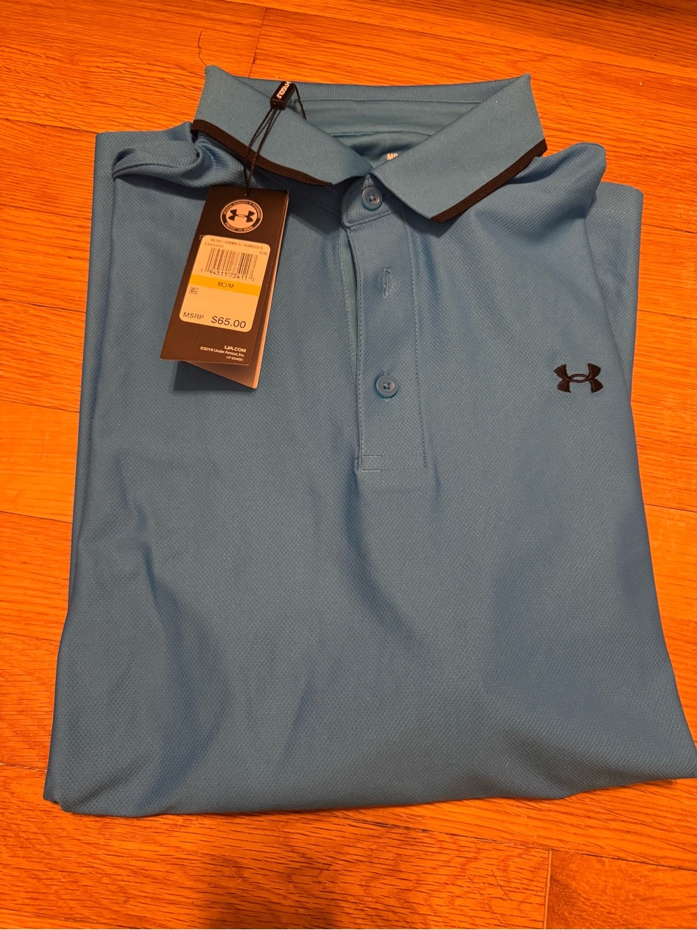 Under Armour Men’s Light Blue Polo with Black Logo